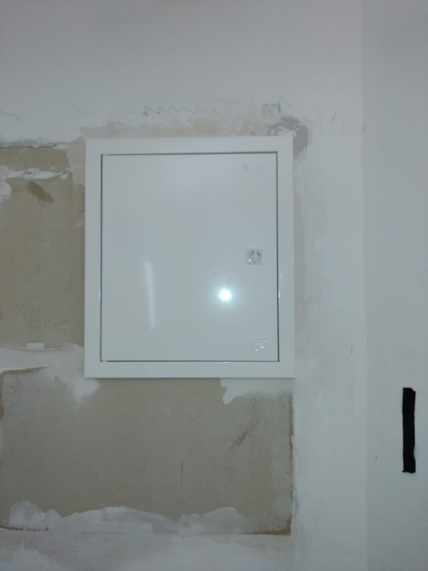 New consumer unit enclosure fitted into a prepared wall opening