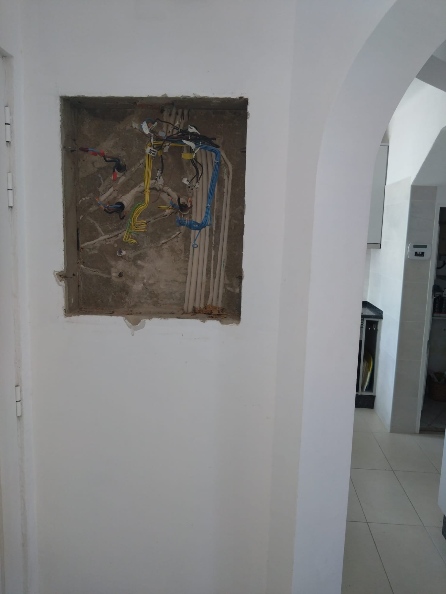 Existing wiring exposed during a consumer unit upgrade
