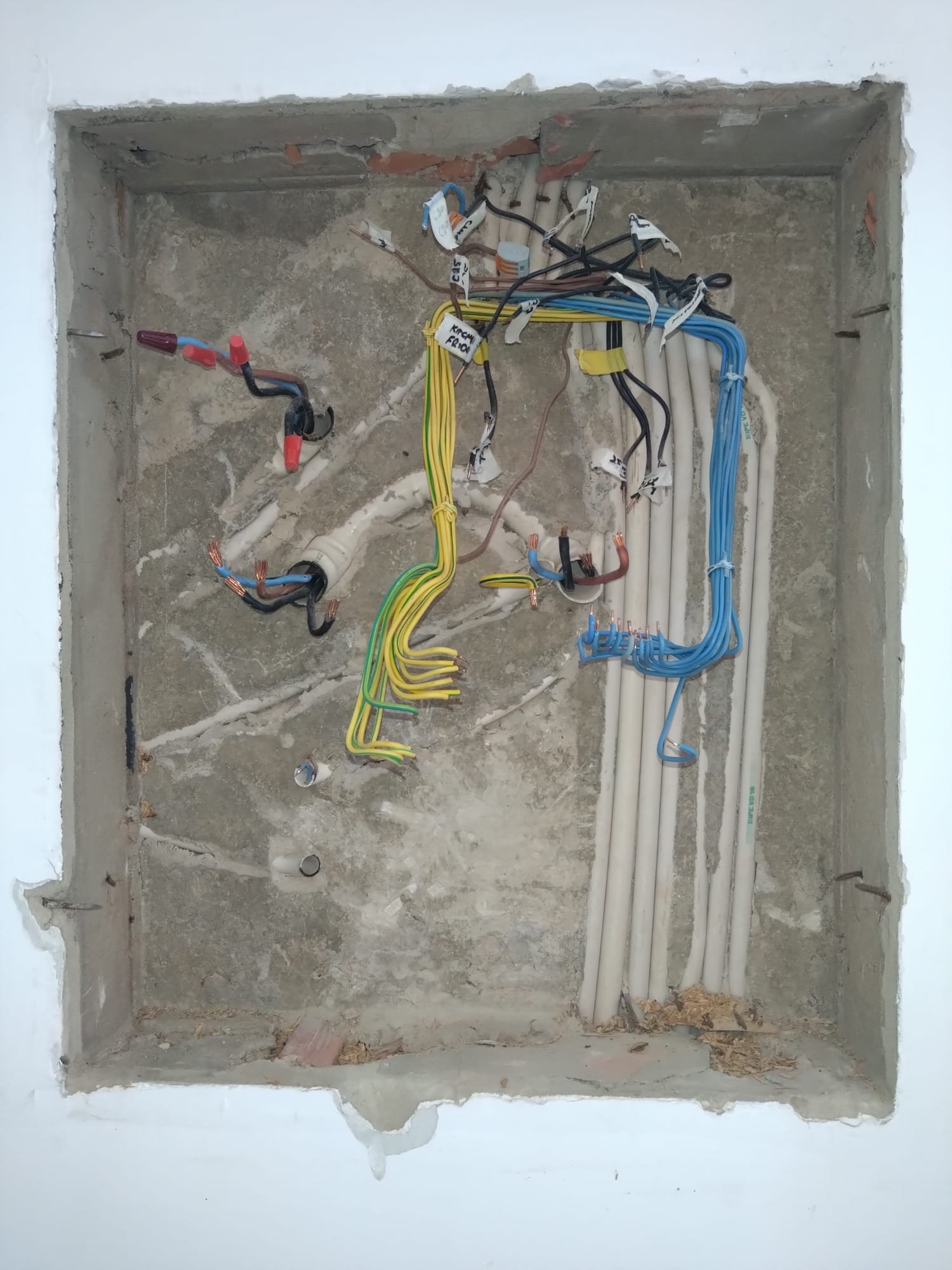Consumer unit wiring exposed during an electrical upgrade