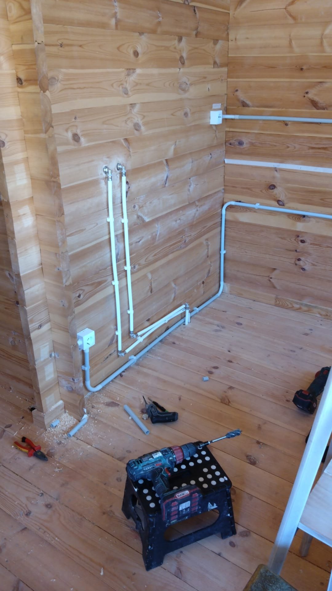 Surface-mounted electrical conduit installed in a timber room