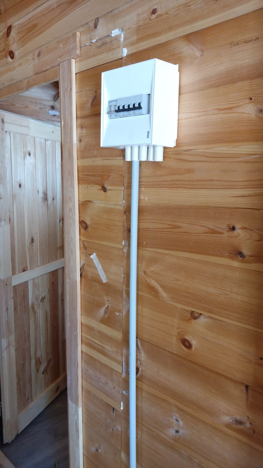 Consumer unit installed with conduit in a timber building